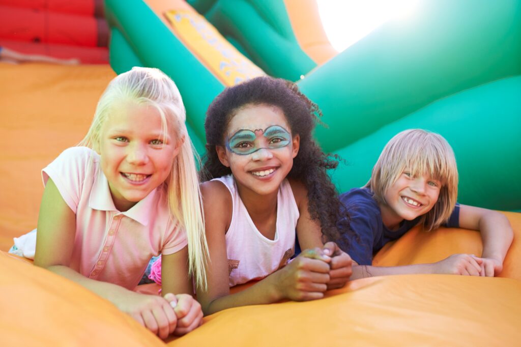 Portrait of Children on an inflatable slide
